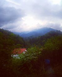 Scenic view of mountains and lake against sky