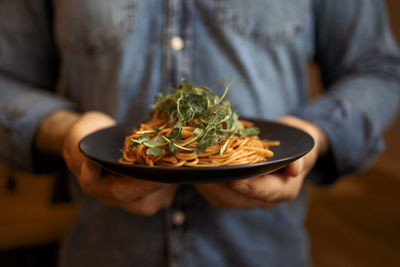 Midsection of man having food