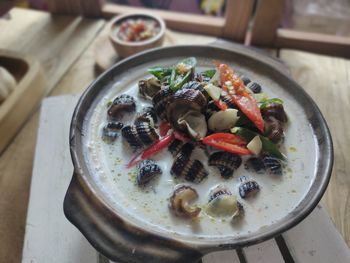 High angle view of fruits in plate on table