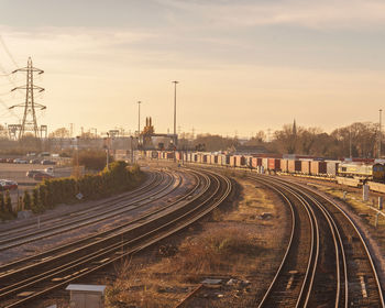 High angle view of railroad tracks against sky during sunset