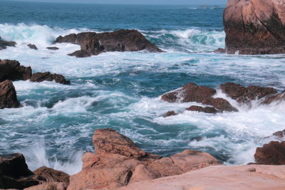 Waves splashing on rocks