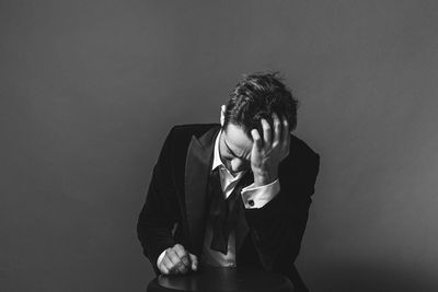 Young man against white background