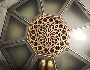 Low section of person on ceiling