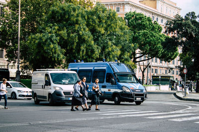 People on road in city