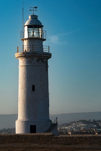 Paphos lighthouse, lighthouse by sea against sky