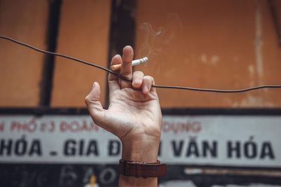 Hand holding cigarette