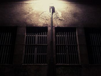 Low angle view of illuminated lighting equipment