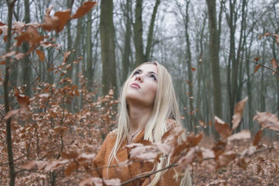 Portrait of young woman in forest