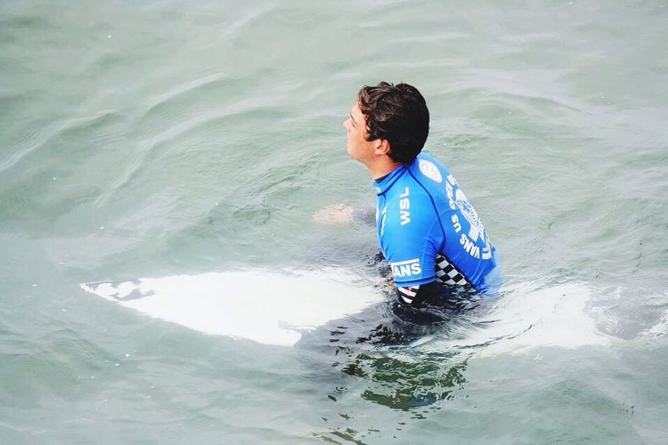 water, lifestyles, leisure activity, sea, childhood, high angle view, boys, person, waterfront, full length, elementary age, vacations, wave, motion, day, rippled, enjoyment, nautical vessel