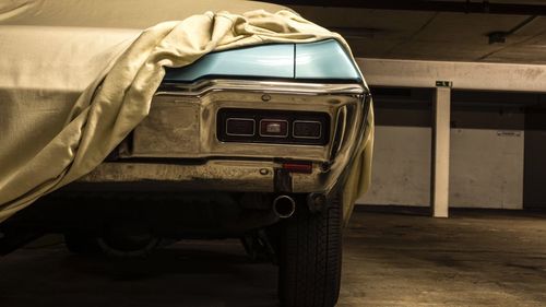 Close-up of old car in basement