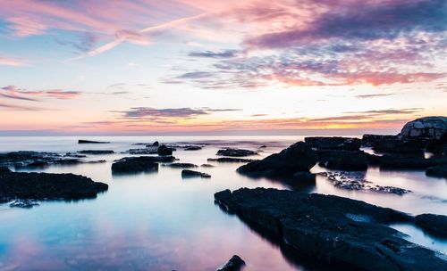 Scenic view of sea against sky at sunset