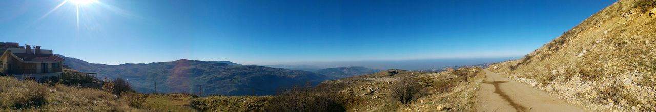 Scenic view of landscape against clear blue sky