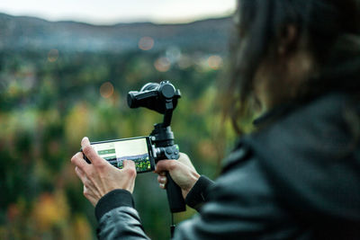 Close-up of man holding camera