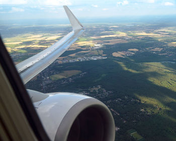 Aerial view of landscape seen through airplane window