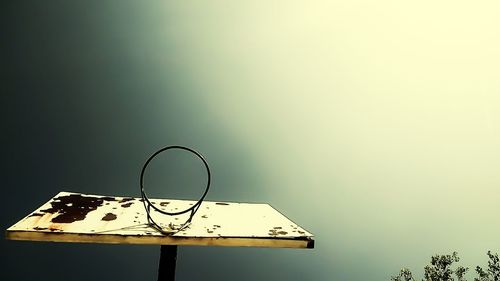 Electric lamp on table against clear sky