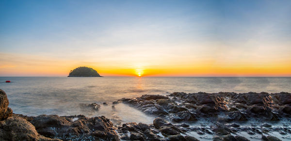 Scenic view of sea against sky during sunset