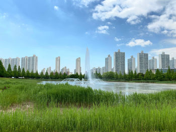 Panoramic view of buildings in city against sky