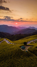 Scenic view of landscape against sky during sunset