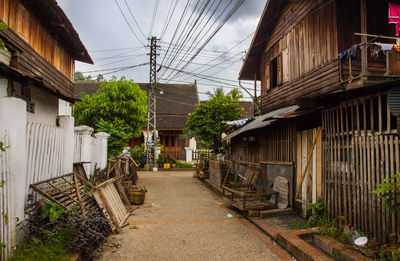 Louangphabang streets with timber housing and overheads cables