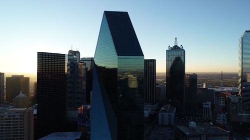 Modern buildings in city against sky