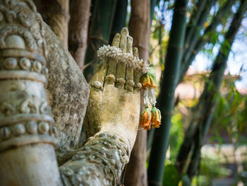 Statue of buddha against temple