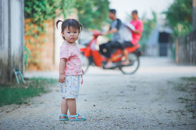 Portrait of cute girl riding motorcycle