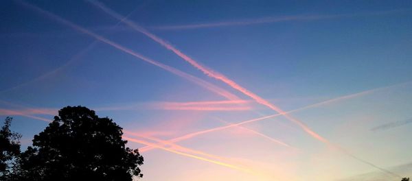Low angle view of vapor trails in sky