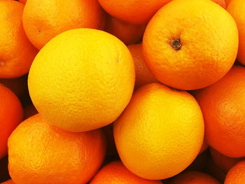 Full frame shot of orange fruits in market for sale