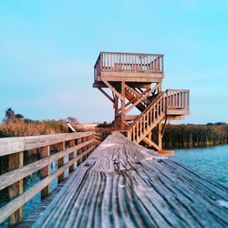 View of pier against clear blue sky