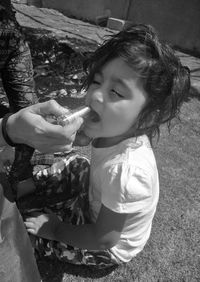 High angle view of girl holding ice cream