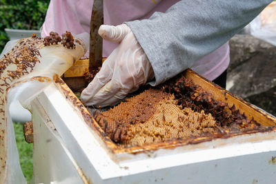 Midsection of man preparing food