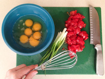 Close-up of hand holding vegetables