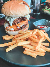 Close-up of fries with meat and sauce in plate