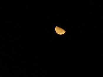 Low angle view of moon against sky at night