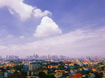 High angle view of buildings in city against sky