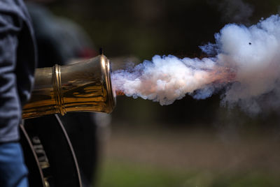Close-up of smoke emitting from glass