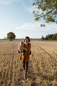 Full length of woman standing on field