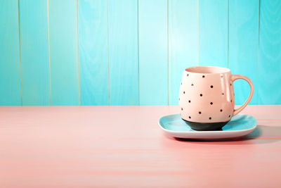Close-up of coffee cup on table
