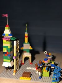 Multi colored toy in city against building