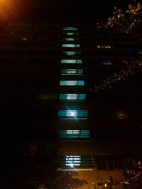 Low angle view of illuminated building at night