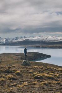 Man looking at sea against sky