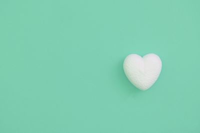High angle view of heart shape over white background