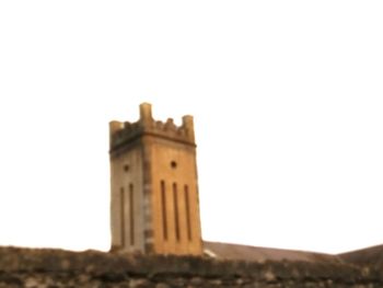 Low angle view of old building against clear sky
