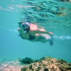 Woman swimming in sea