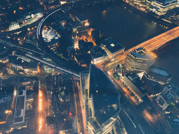 High angle view of city lit up at night