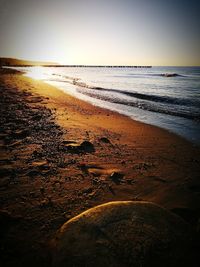 Scenic view of beach against clear sky