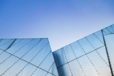 Low angle view of modern buildings against sky