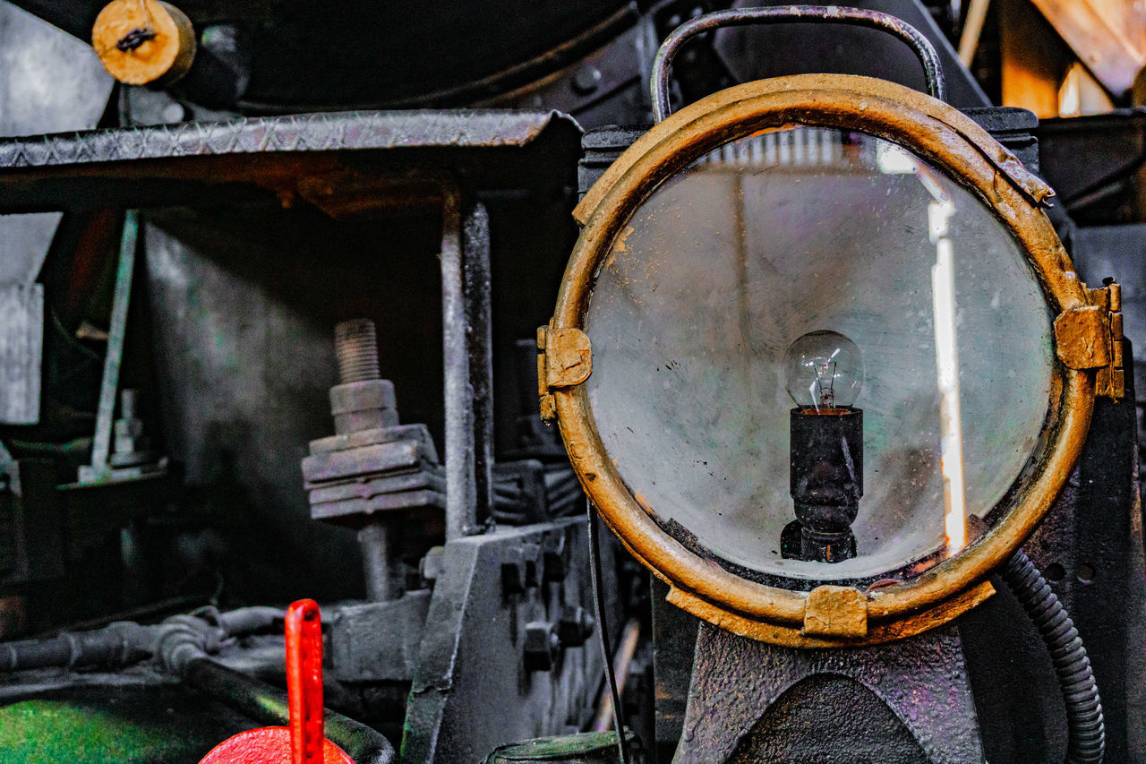 LOW ANGLE VIEW OF OLD MACHINERY IN FACTORY