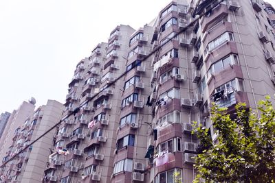 Low angle view of buildings against clear sky