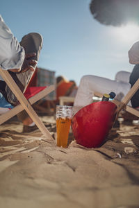 Close-up of drink on table against sky